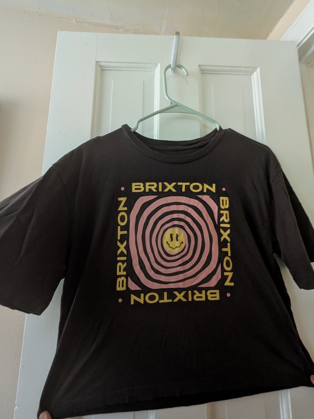 Brixton Black Tee with Pink Concentric Graphic & Yellow Smiley